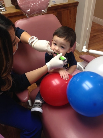 Young-boy-gets-a-dental-checkup-at-AV-Sierra-Dental-Centers-Freedom-Day-event